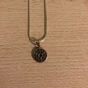 Sterling silver necklace w/heart chakra charm.